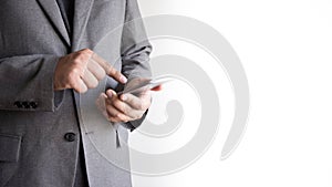 businessman working Happy holding smart phone and smiling. Looking phone and copy space