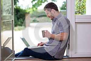 Businessman Working From Home On Laptop During Pandemic Lockdown