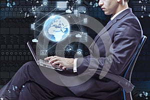 The businessman working with laptop in cloud computing concept