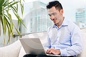 Businessman working with laptop from home
