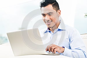 Businessman working with laptop from home