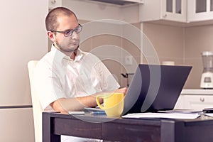 Businessman working on laptop at home office