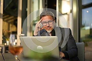 Businessman working with laptop in hotel