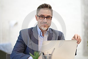 Businessman working with laptop in office