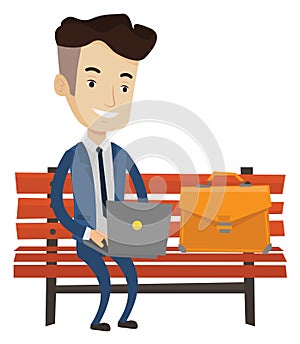 Businessman working on laptop outdoor.
