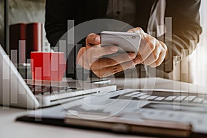 Businessman working with mobile phones and modern computers and business strategy icons in the morning