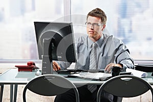 Businessman working at office desk