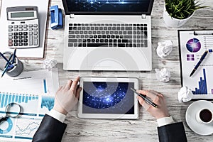 Businessman working at office desk with data