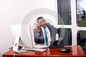 Businessman working in office while making video call on digital tablet