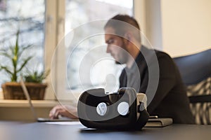 businessman working in office virtual reality goggles waiting for him