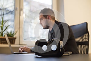 businessman working in office virtual reality goggles waiting for him