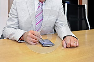 Businessman working with phablet photo