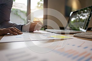 Businessman working on report documents at home