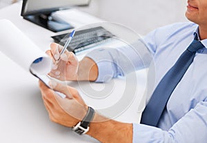 Businessman working and signing papers