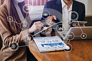 Businessman working with smart phone and laptop and digital tablet computer in office with digital marketing media  in virtual