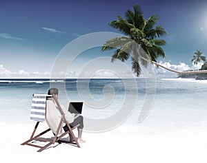 Businessman Working on a Tropical Beach Concept