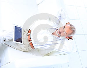 Businessman working and using a tablet