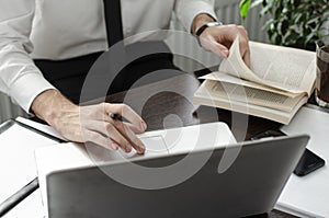 Businessman working in workplace.Stylish man in shirt and tie.