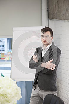 businessman works in an office and stands thoughtfully