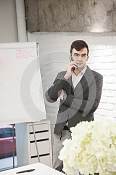 businessman works in an office and talks on the phone