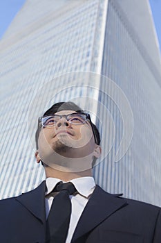 Businessman by the world trade center in Beijing, China