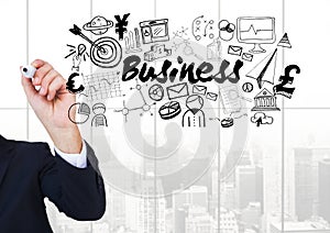 Businessman writing and Business text with drawings graphics