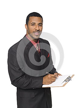 Businessman - writing on clipboard photo