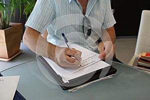 Businessman writing contract