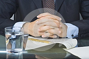 Businessman writing in a document