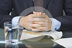 Businessman writing in a document