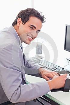 Businessman writing into his pocket calender