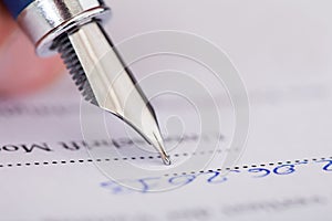 Businessman Writing With Ink Pen