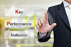 Businessman writing key performance indicator KPI