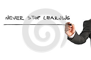 Businessman writing - Never stop learning