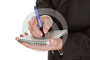 Businessman writing notes