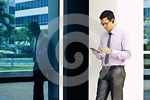 Businessman Writing With Pen On Mobile Phone Display-3