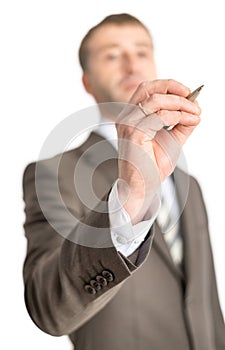 Businessman writing with pen on screen