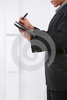 Businessman writing schedule