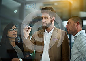 Businessman, writing and schedule planning with glass board for tasks or brainstorming at office. Young man or employee