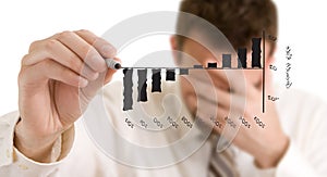 Businessman is writing on a virtual whiteboard