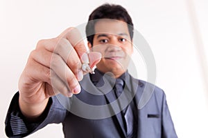 Businessman is writing on a virtual whiteboard