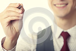 Businessman is writing on a virtual whiteboard