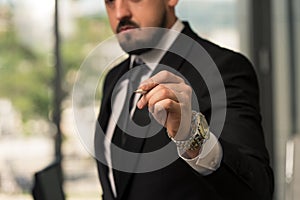 Businessman Is Writing On A Virtual Whiteboard Flipchart