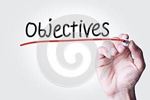 Businessman written objectives text in screen