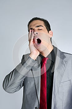Businessman yawn boring on gray background