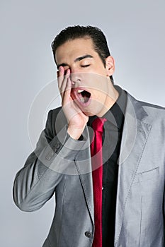 Businessman yawn boring on gray background