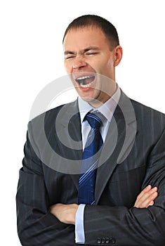 A businessman yawns.