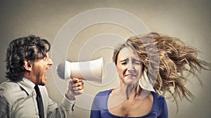 Businessman yelling with a megaphone