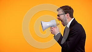 Businessman yelling in megaphone, announcement of breaking news, place for text