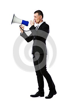 Businessman yelling through megaphone